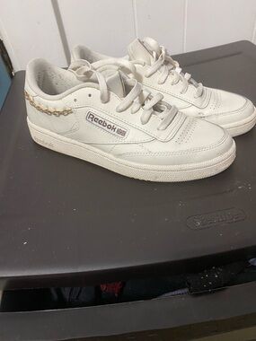 Reebok Off-White Leather Low-Top Sneakers with Gold Chain Accent
